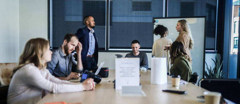 prosci-change-managers-in-conference-room-review-risk-assessment